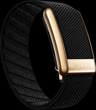 WHOOP device with a black woven band and gold clasp